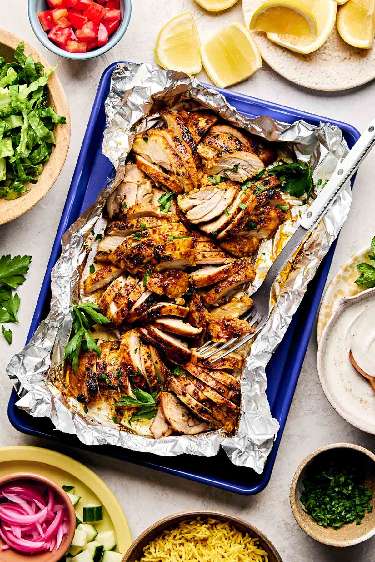 Roasted Chicken Shawarma — Skinless chicken thighs marinated in warm shawarma spice, roasted until charred at the edges.