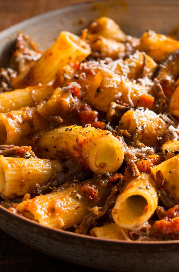 Rustic Braised Beef Rigatoni (Gluten Free) — Beef slow-braised in tomato sauce with basil and rosemary, tossed with gluten-free rigatoni.